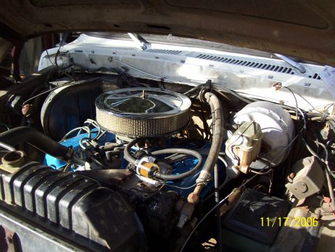 1978 Ford Bronco - The engine bay of a white vehicle shows a blue engine block and chrome air cleaner, with a date stamp of 11/17/2006.