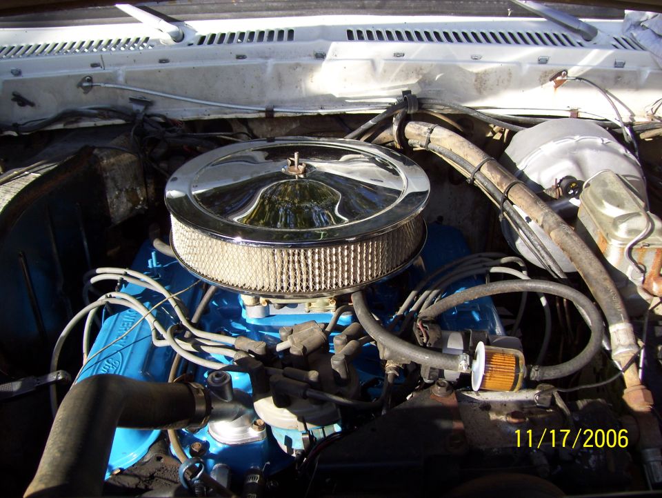 Engine bay with blue engine block and chrome air filter