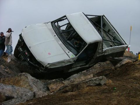 1995 Ford Bronco - This modified 1995 Ford Bronco has rolled onto its side while navigating a challenging rocky course.