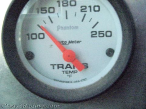 1990 Ford Bronco - Auto Meter Phantom trans temp gauge with red needle pointing just past 100 degrees Fahrenheit.