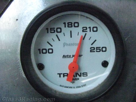 1990 Ford Bronco - Auto Meter Phantom trans temp gauge with red needle pointing to about 210 degrees Fahrenheit.