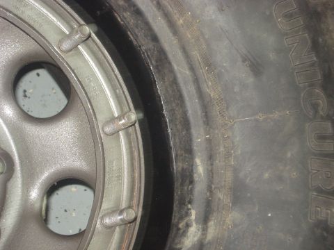 1996 Ford Bronco - Rim forced in insert again.