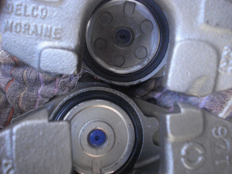 Close-up of Delco Moraine brake caliper pistons during disc brake service
