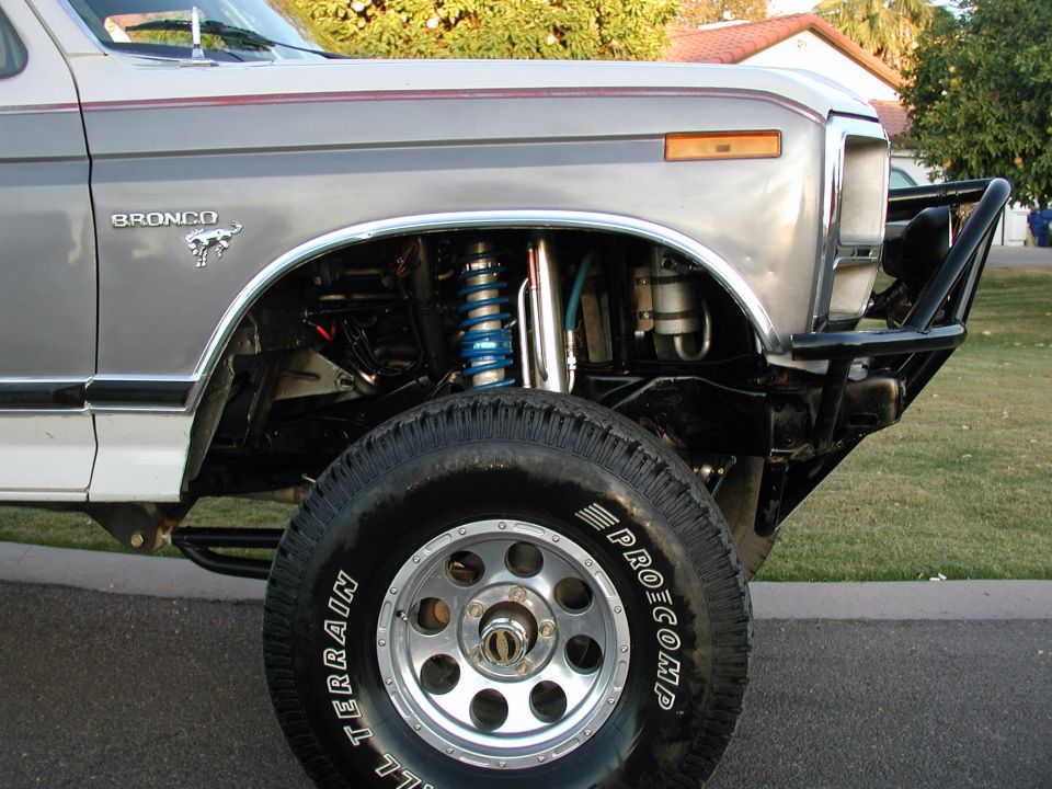 Front quarter of a 1980 Ford Bronco with aftermarket bumper and suspension