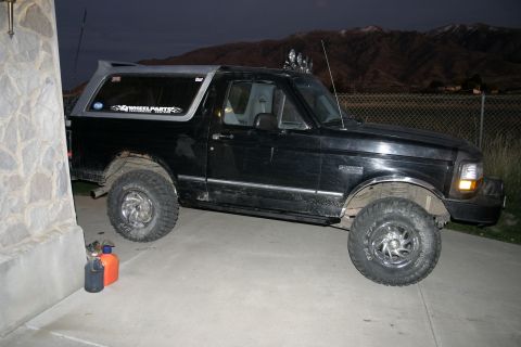 1994 Ford Bronco - This black Ford Bronco has a removable hardtop and off-road tires.