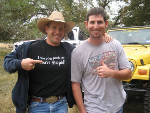2001 Jeep Wrangler - Two men pose for a photo in front of a yellow Jeep Wrangler and a white truck.