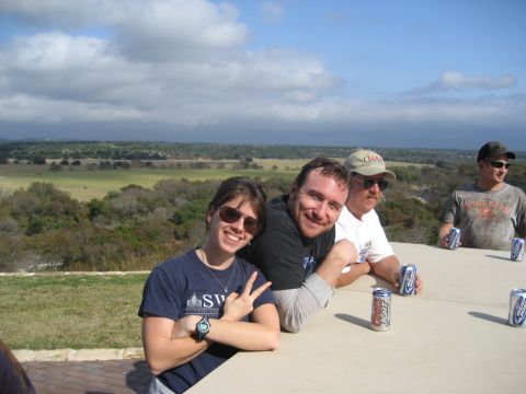 2001 Jeep Wrangler - People enjoy drinks and a scenic view outdoors on a cloudy day.