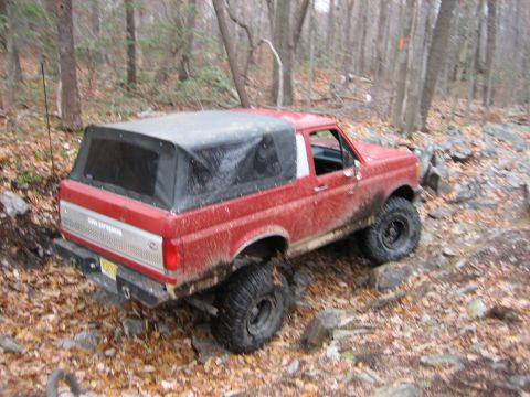 1990 Ford Bronco - This 1990 Ford Bronco navigates a challenging off-road course.