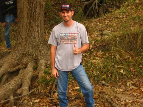 2001 Jeep Wrangler - A man stands outdoors near a tree, giving a thumbs up gesture.