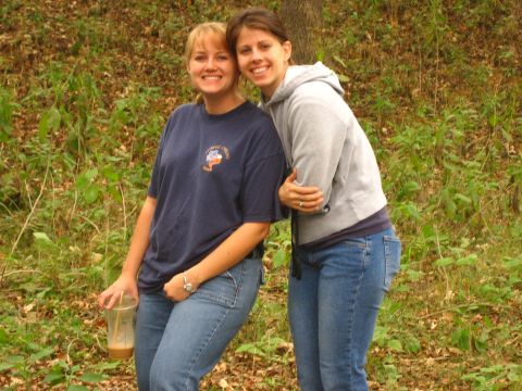 2001 Jeep Wrangler - Two women pose for a photo in a natural, outdoor setting with trees and foliage in the background.