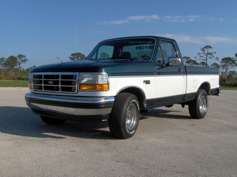 1995 Ford F-150 - This 1995 Ford F-150 pickup truck is shown from the front three-quarter view.