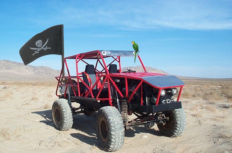 Red off-road buggy with pirate flag and parrot on roof