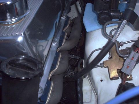 1978 Ford Mustang II - A view into the engine bay shows various mechanical components and wiring harnesses.