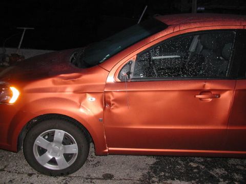 2007 Chevrolet Aveo - This 2007 Chevrolet Aveo shows extensive damage to its front fender and driver's side door.