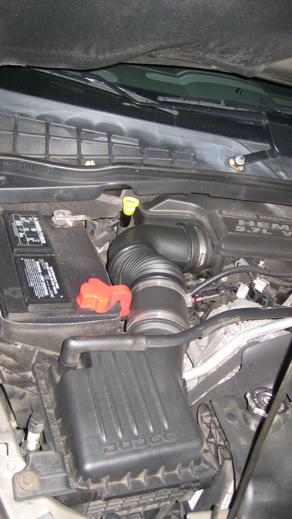 2004 Dodge Durango engine bay with air intake and battery