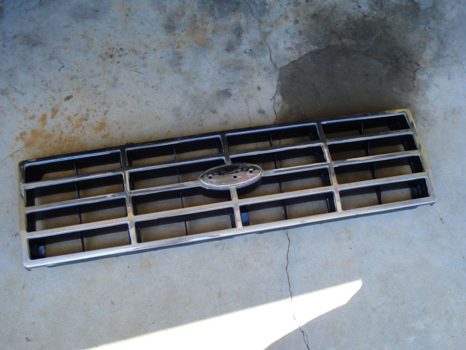 1984 Ford Bronco grille with chrome trim and oval Ford emblem