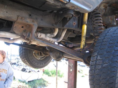 1995 Ford F-150 - Undercarriage view of a 1995 Ford F-150, highlighting suspension and exhaust system details.