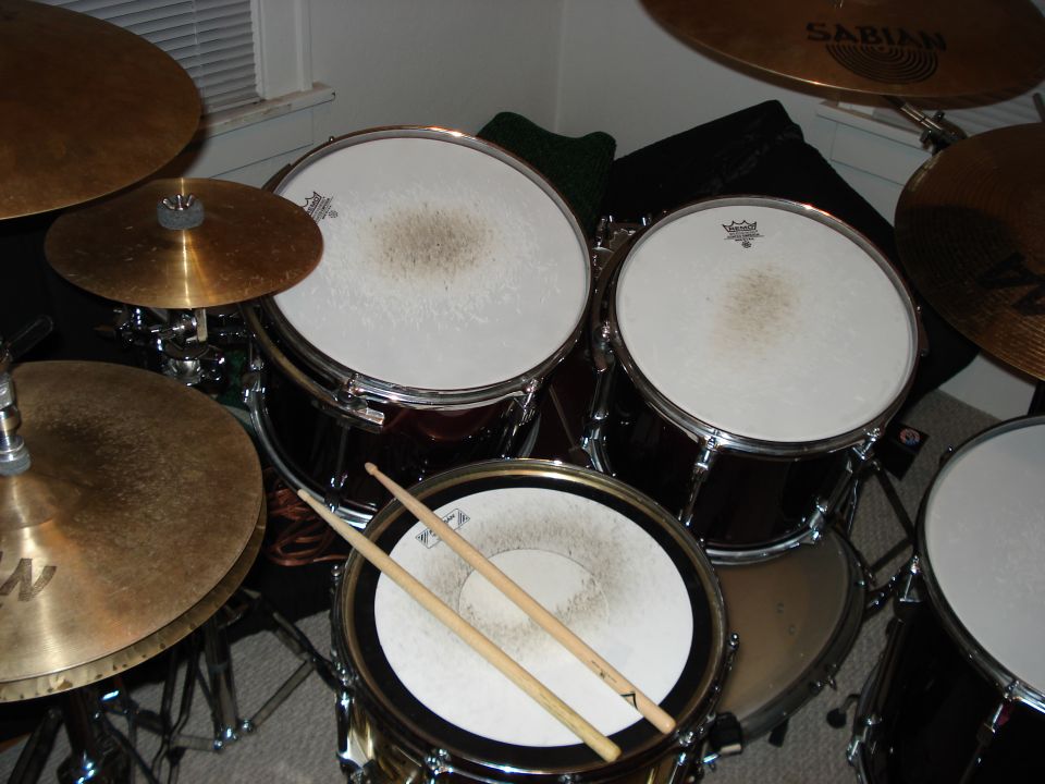 Drum kit with cymbals and drumsticks
