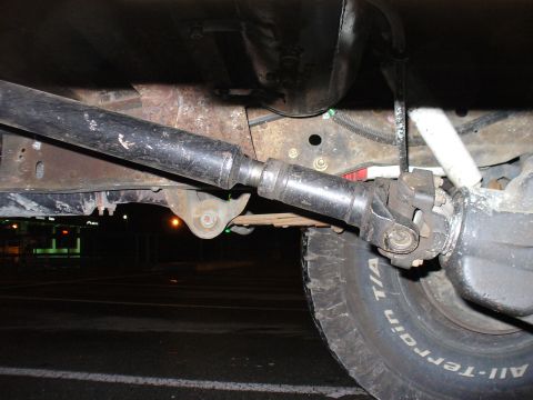 1978 Ford Bronco - Undercarriage view of a 1978 Ford Bronco, focusing on the rear driveshaft and axle components.