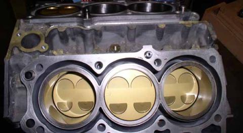 1996 Ford Probe - Close-up view of an engine's cylinder head and pistons.