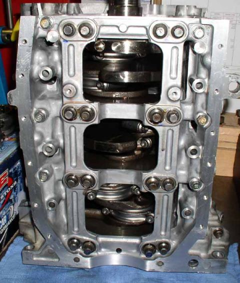 1996 Ford Probe - Close-up view of an engine block's internal components, including the crankshaft and connecting rods.