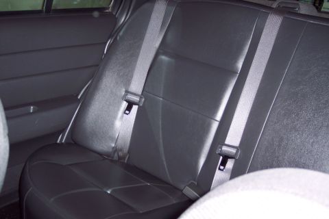 2001 Ford Crown Victoria - Interior view of car's back seat and seatbelts.