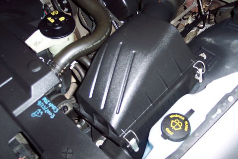 2001 Ford Crown Victoria - The air intake system is visible in this engine bay shot. Text on a component indicates a date of 9/25/2003.