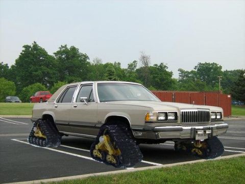 1988 Mercury Grand Marquis - This car has been modified with tank treads for off-road capability.