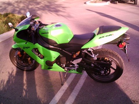 2005 Kawasaki Ninja R - 2005 Kawasaki Ninja ZX-6R motorcycle, side view, parked on asphalt.