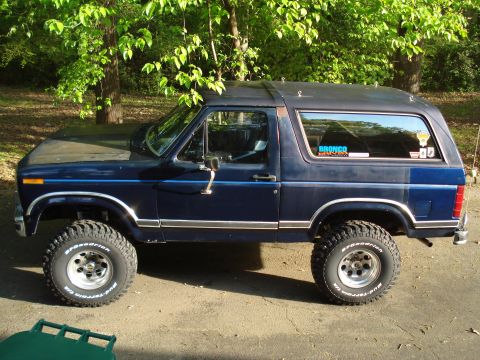 1984 Ford Bronco - This Ford Bronco has a sticker on the rear window that says 'Bronco' and 'Super Motors'.