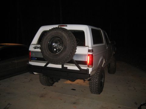 1996 Ford Bronco - all that is left is mounting the hi-lift and liscense plate. I also have to make a stop so the carrier doesnt swing all the way around.