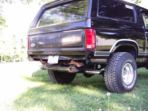 1983 Ford Bronco - black ducktape covering the holes untill i get them filled and worked smooth. also note the big rust spot at the bottom.