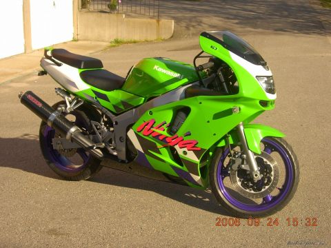1997 Kawasaki Ninja R - A 1997 Kawasaki Ninja R motorcycle is shown from a three-quarter front angle, a vibrant green and white color scheme.
