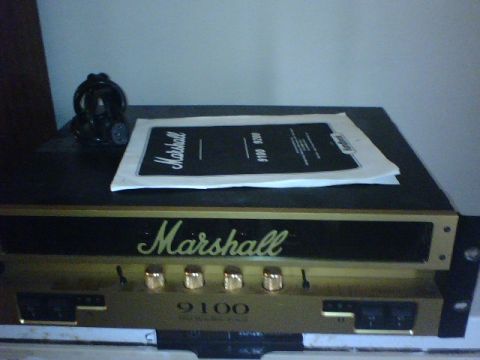 1995 Ford Bronco - A Marshall 9100 amplifier is shown with its manual resting on top, alongside a pair of headphones.