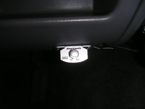 1994 Ford Bronco - A close-up view of a car's interior shows a Power Acoustik remote control knob for an amplifier.