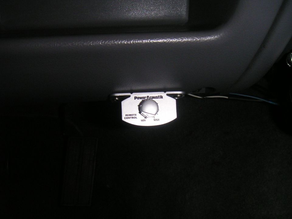 car amplifier remote control knob with 'Power Acoustik' logo and min/max settings