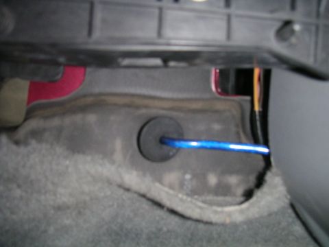 1994 Ford Bronco - Wire installation in vehicle interior, likely for audio system components.