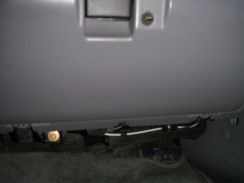 1994 Ford Bronco - Close-up view of the wiring and components located beneath the dashboard of a vehicle.