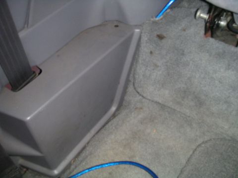 1994 Ford Bronco - Interior view of a vehicle's passenger side, focusing on carpet and trim.
