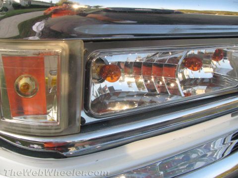 1994 Chevrolet Silverado 3500 - The front corner marker light and headlight assembly of a truck are shown in this close-up shot.