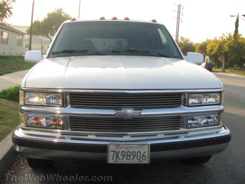1994 Chevrolet Silverado 3500 - Front view of a white Chevrolet pickup truck with a chrome grille and amber front turn signals.