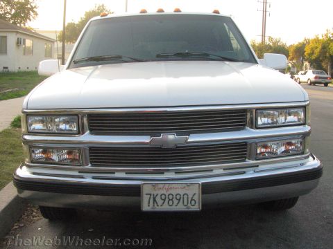 1994 Chevrolet Silverado 3500 - Front view of a white Chevrolet pickup truck with a chrome grille and amber marker lights.