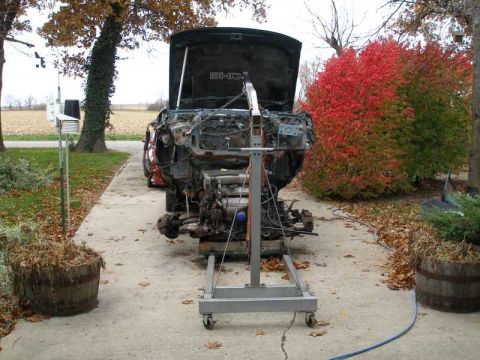 1993 Ford Taurus - Engine removed from a car and placed on an engine stand for repair or maintenance.