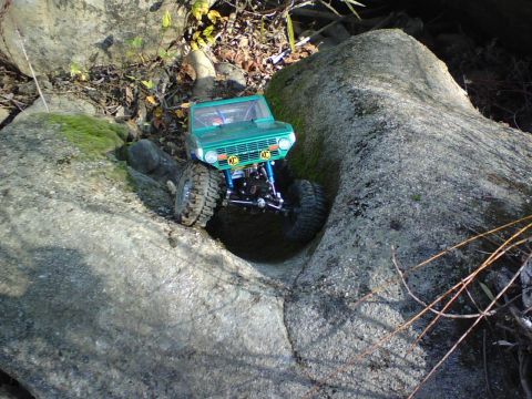 1996 Ford Bronco - RC rock crawler tackles a challenging rocky terrain.