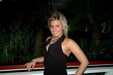 1991 Ford Bronco - A woman poses for a photo at an outdoor event at night.