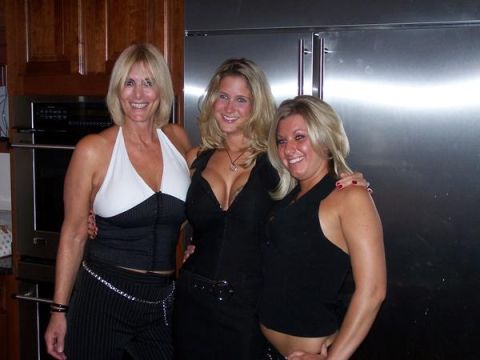1991 Ford Bronco - Three women smile for the camera in a domestic setting with modern kitchen appliances.