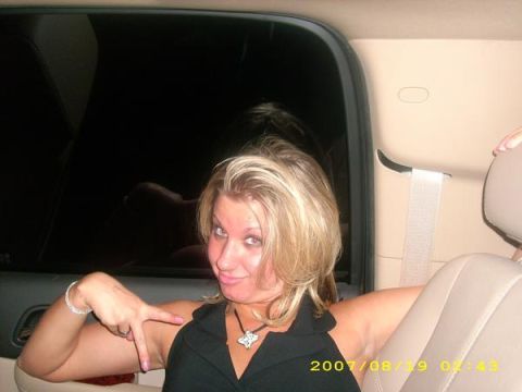 1991 Ford Bronco - Woman in car interior with a peace sign gesture. Watermark indicates 2007.