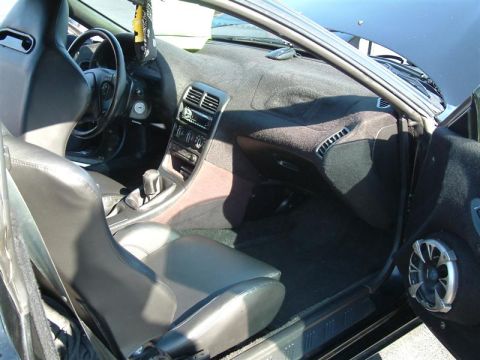 1995 Ford Probe - The interior of a car is shown, aftermarket bucket seats and a modified dashboard.