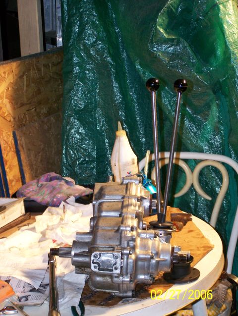 1988 Suzuki Samurai - A twin stick transfer case, likely for an off-road vehicle, is shown on a table with two prominent levers.