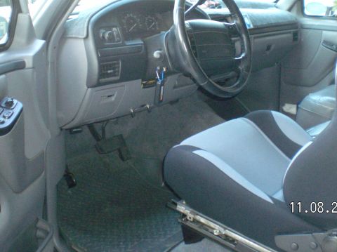 1996 Ford Bronco - Put a black & grey cloth racing seat in on the drivers side, I had to buy some 1/4" flat bar and cut to fit while using the stock seat brac…